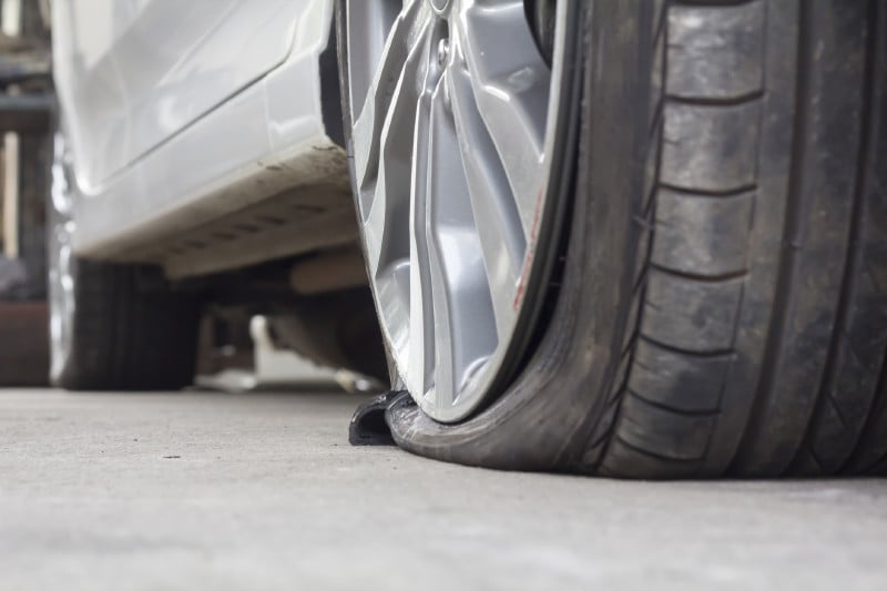 Flat Back Tire of a Car | Saving for Unexpected Costs