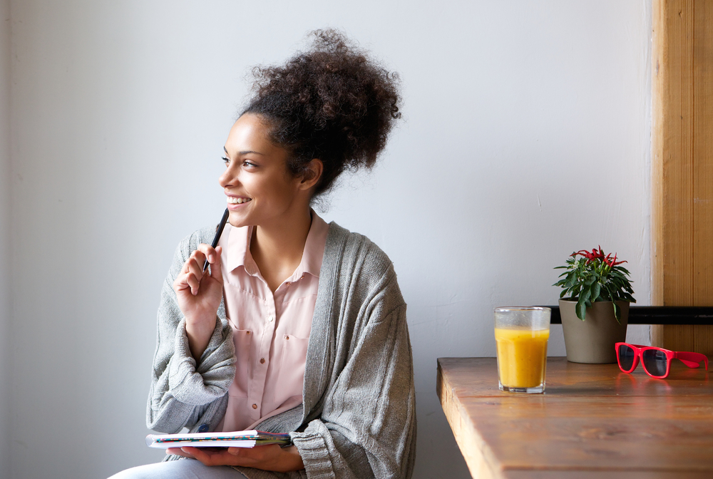 Young woman sitting at home