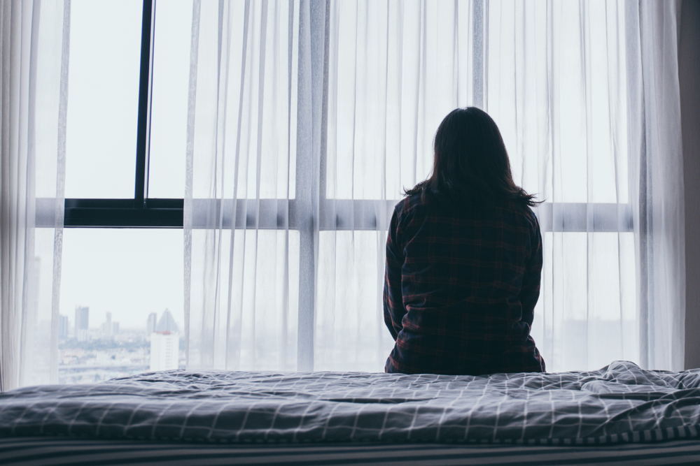 Woman looking out of window