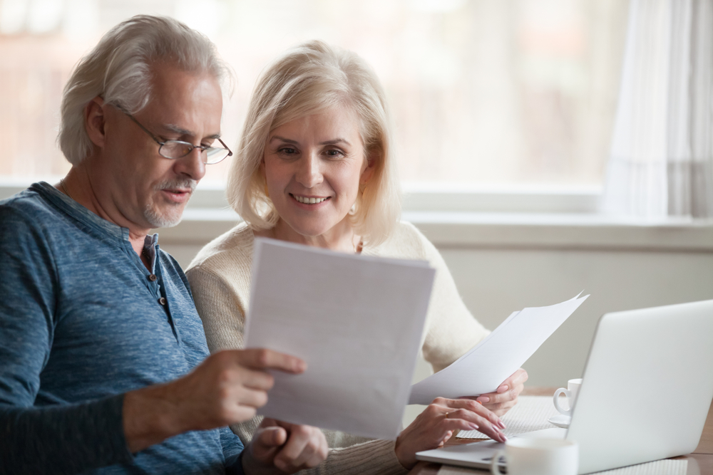 Middle Aged Couple Preparing Documents