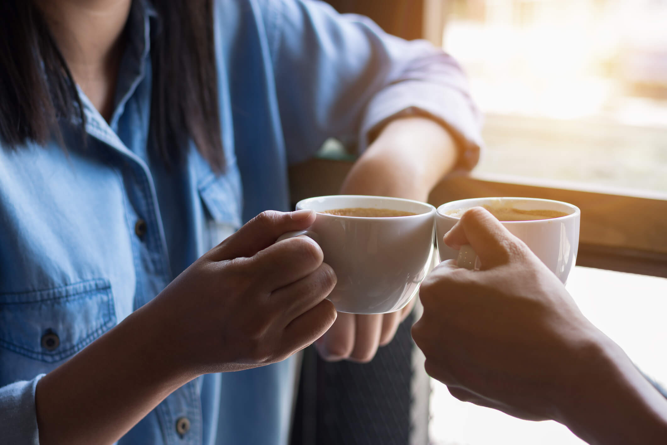 Two People Drinking Coffee Together