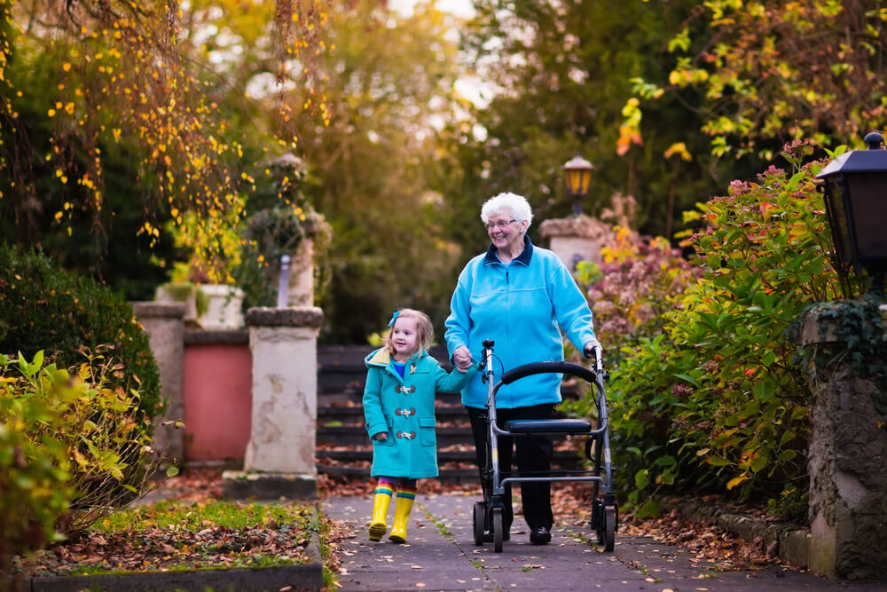 Old woman and little girl walking