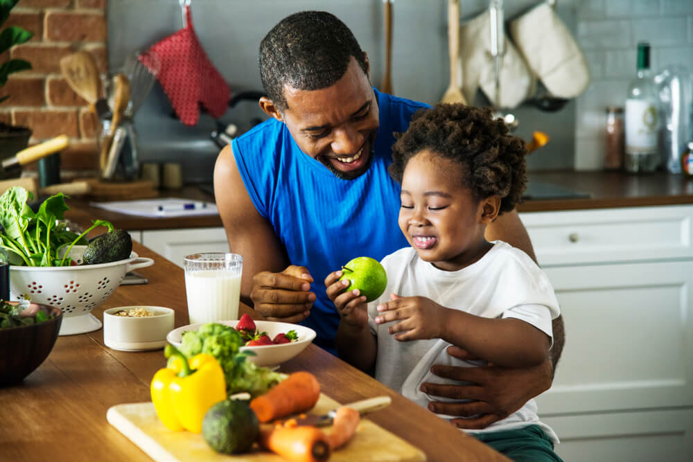 Father with his child cooking in the kitchen