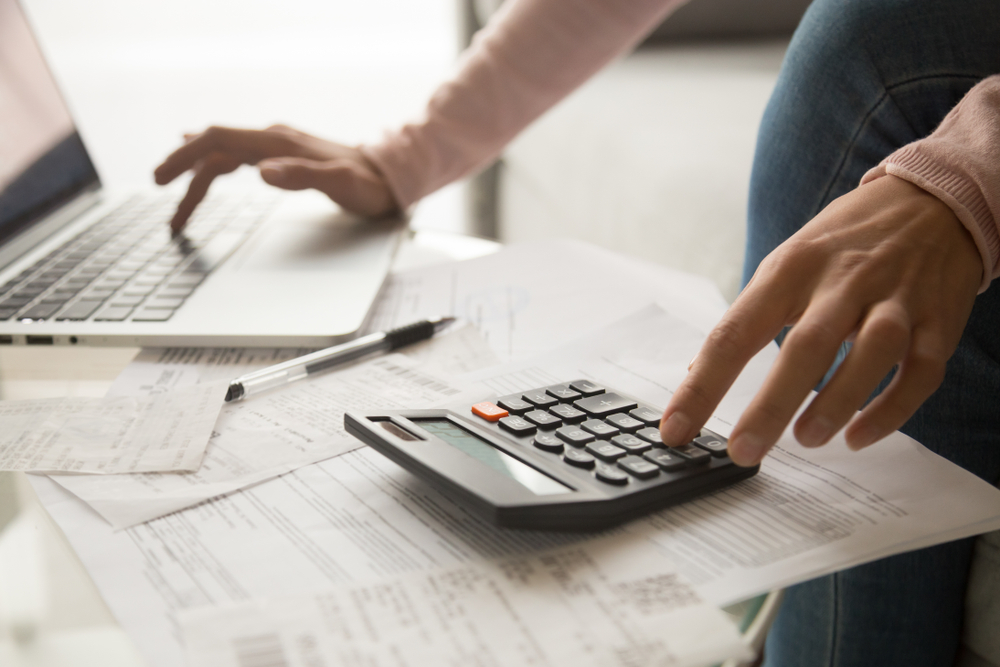 Woman using calculator